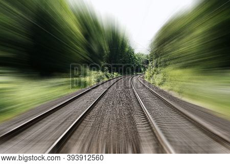 Double-track Railroad Railway Or Train Tracks With Speed Motion Blur - Fast Travel Concept Backgroun
