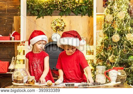 Cute Kids In Santa Hats Preparation Holiday Dinner For Family. Two Cute Boys With Santa Hat. Two Chl