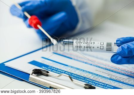 Medical Worker Holding Coronavirus Covid-19 Np Op Swab Sample Test Kit, Nasal Collection Equipment, 