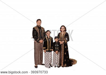 Portrait Of A Happy Family Wearing Traditional Javanese Clothes.