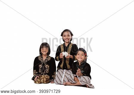 Happy Portrait Of Three Adorable Brothers And Sisters.
