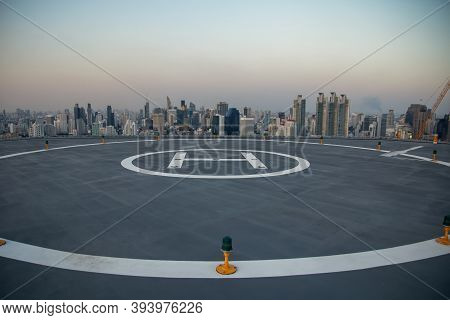 Selective Focus Of The Heli Copter Parking Lot On The Deck At Sunset In The Capital Of Thailand. Spa