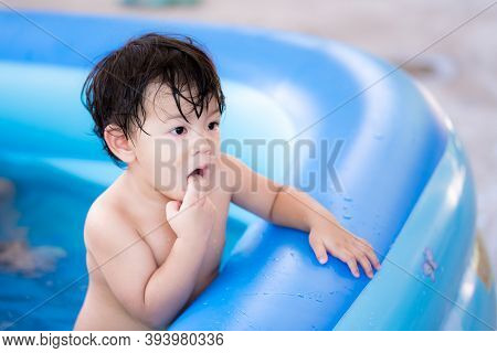Asian Child Boy Used Finger Elude In His Mouth And He Standing In Pool Without Clothes. Cleanliness 