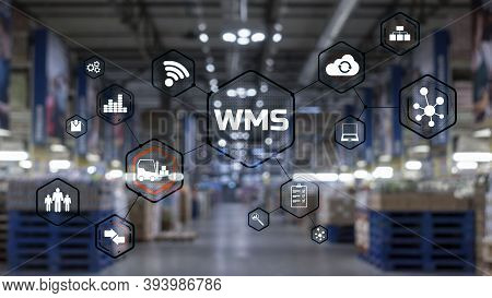 Inscription Wms On Blurred Warehouse Background. Werehouse Management System.