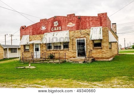 LITCHFIELD, IL - AUGUST 8:  Vacant Route 66 Cafe with faded awnings and a brick exterior in red, brown, and beige August 8, 2013 in Litchfield, Illinois.