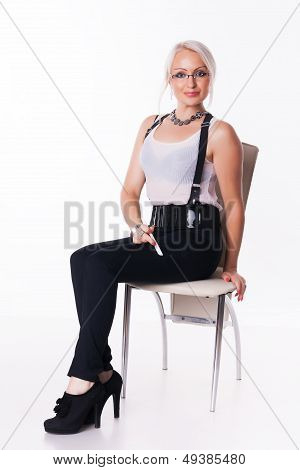 Businesswoman sits on a chair
