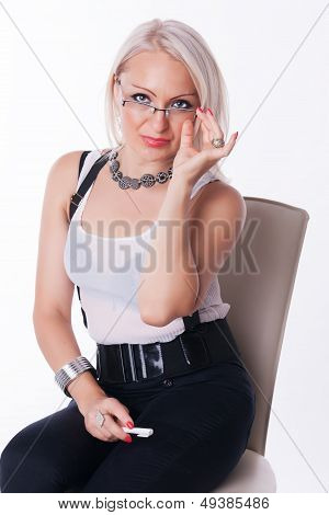 Businesswoman sits on a chair
