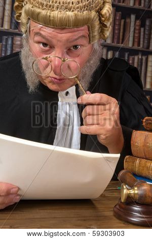Funny old judge looking through a lorgnette