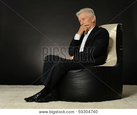 Businessman sitting in armchair