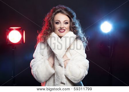 Woman In Winter Fur With Two Lights Behind