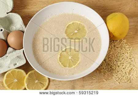 Avgolemono soup - made with chicken broth, lemon, egg and rice-shaped pasta. This is a very traditional Greek dish.