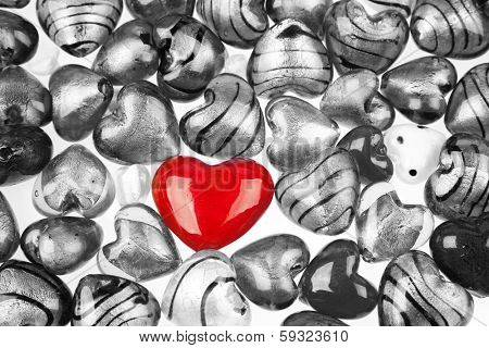 One red heart standing out in crowd