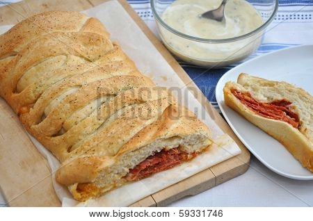 Stromboli - italian sandwich filled with ham and cheese