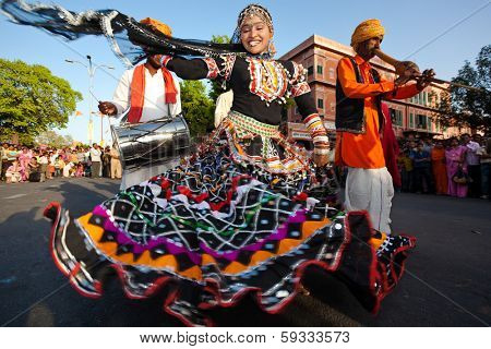RAJASTHAN, INDIA - MARCH 30, 2009: people celebrating the god who protect them in the Gangaur festival one of the most important of the year