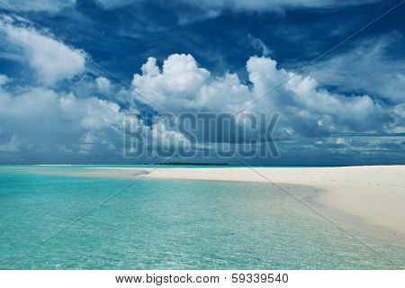 Beautiful island beach with sandspit at Maldives