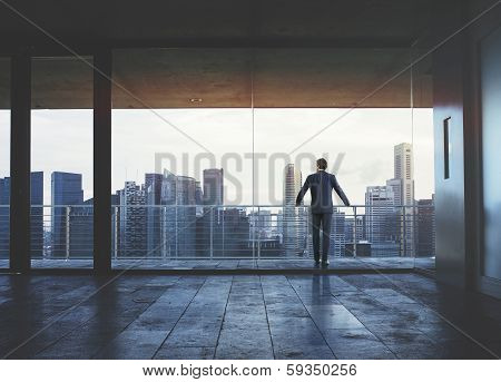 Businessman looking at city