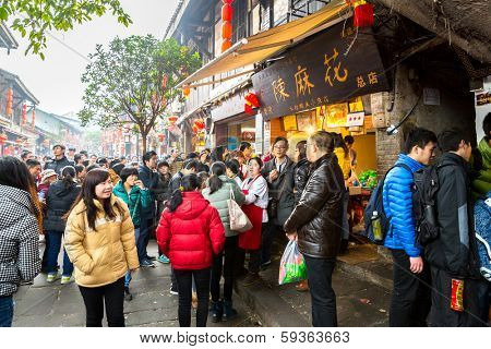CHONGQING, CHINA - JAN 17: Unidentified tourists are shopping at Ciqikou Ancient Town on January  17, 2014 , Chongqing, China.