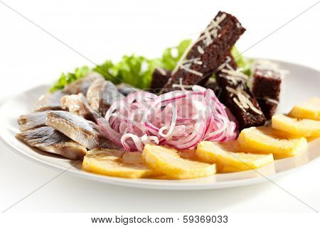 Herring Served with Potato, Onions and Bried Sticks
