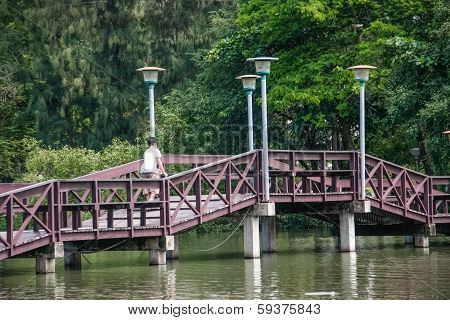 Wooden Bridge Over Pond