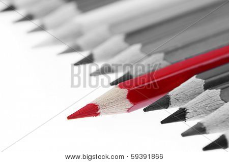 One red pencil standing out from others