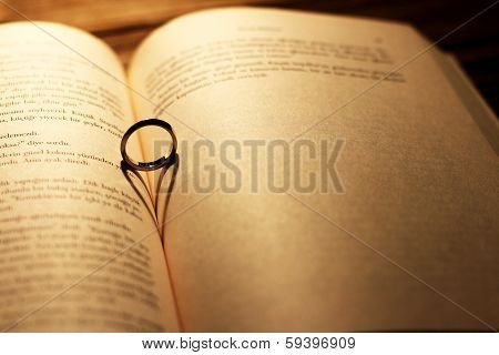 Heart Shadow With Ring On A Book Middle - Write Your Text