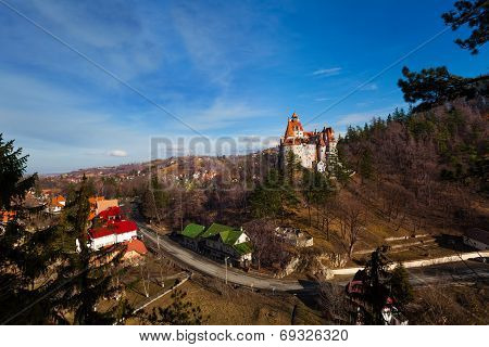Top view of Bran Castle near village and road