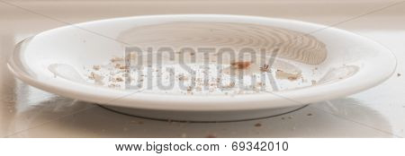 White Plate With Bread Crumbs.