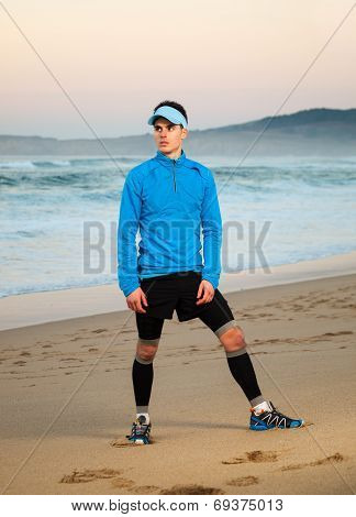 Athlete Standing On The Beach.