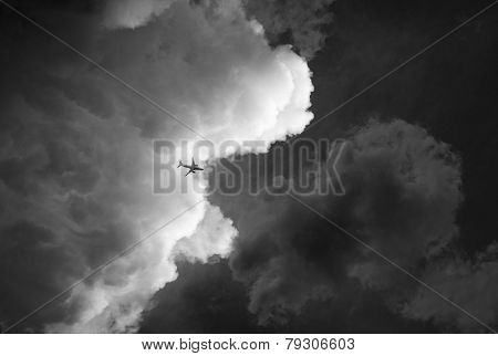 Plane out of clouds