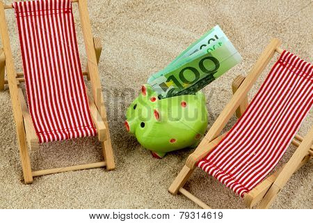 beach chair with euro currency on the sandy beach. symbolic photo for cost of travel, vacation, holidays