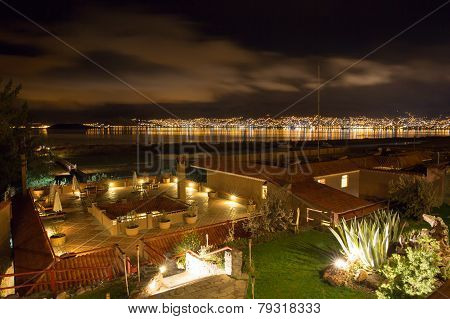 Upscale Hotel And Inviting Courtyard And Garden At Night On Lake Titikaka, Peru In South America