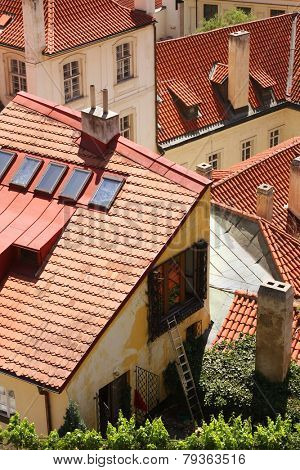 Houses with traditional red roofs in Prague Old Town Square in the Czech Republic 