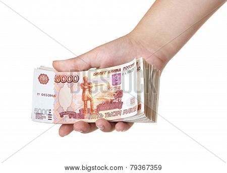 Stack of five thousandth bills in the female hand.
