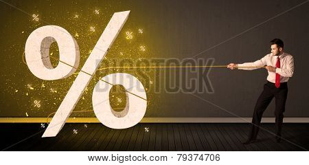 Business man pulling rope with big procent symbol sign concept on background
