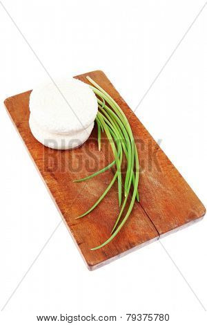 dairy products : feta white cheese on cut board isolated over white background
