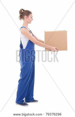 Side View Of Young Attractive Woman In Blue Coveralls Giving Cardboard Box Isolated On White