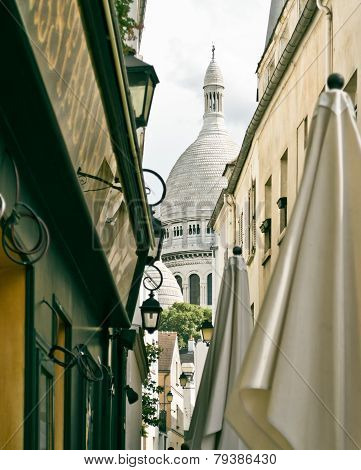 A Small Alley In Montmartre With The Church Of Sacre Coeur In Background, Paris, France