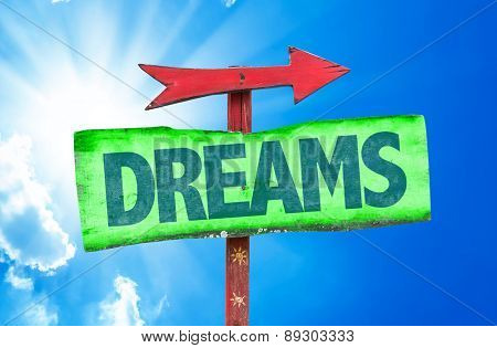 Dreams sign with sky background