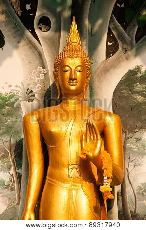 Standing Buddha Front Of Church On Thai Temple In Thailand.