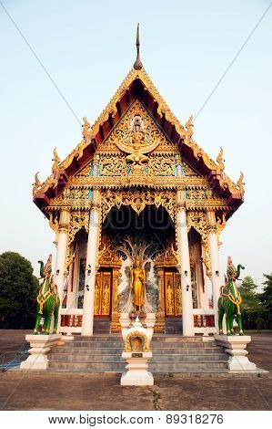 Standing Buddha Front Of Church On Thai Temple In Thailand.