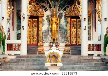 Standing Buddha Front Of Church On Thai Temple In Thailand.