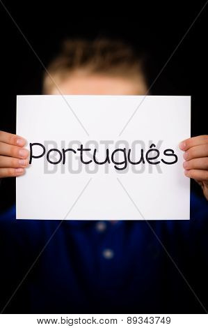 Child Holding Sign With Portuguese Word Portugues - Portuguese In English