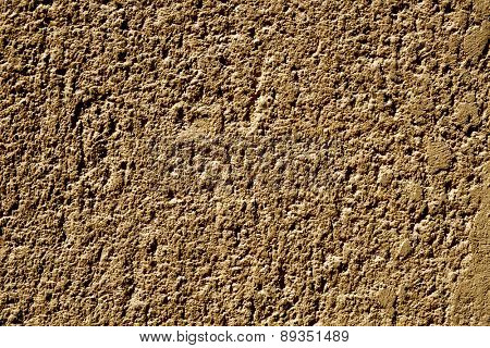 closeup of a rustic brown plastered wall