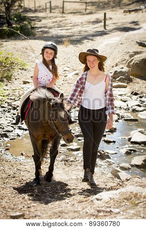 Female Jockey Kid Riding Pony Happy With Mother Role As Little Horse Cowgirl Instructor