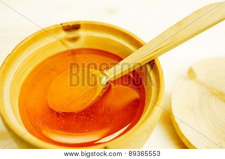 Honey In A Wooden Bowl