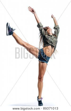 Young beautiful dancer posing in studio