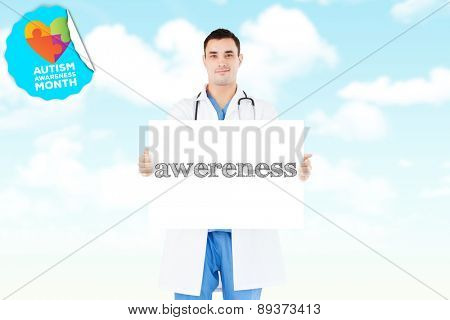 The word awereness and portrait of a doctor holding a blank panel against blue sky