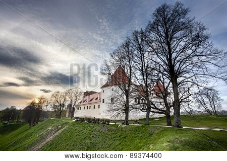 Bauska castle restored part during sunset time. HDR image