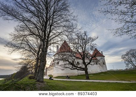 Bauska castle restored part during sunset time. HDR image