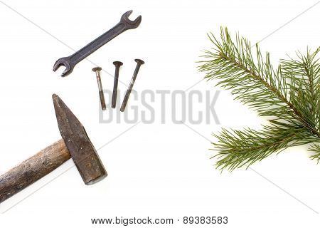 Hammer And Pine Branch Isolated Over White